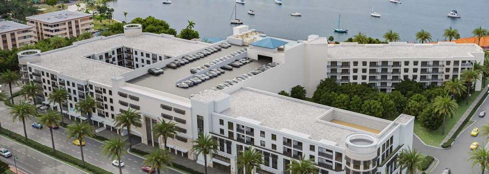 Residential buildings around the central courtyard. This closer aerial concept shows the two residential wings, structured parking, courtyard and Bimini Basin immediately behind the site.