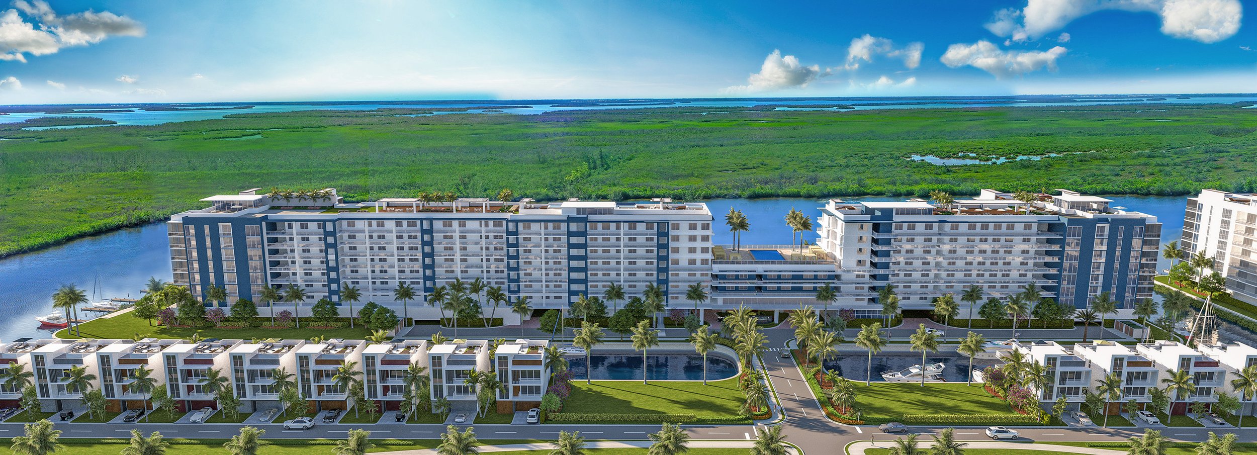 Canal-side building panorama. A long waterfront elevation shows lower residences nearest the canal with larger hotel or condominium buildings arranged behind them.