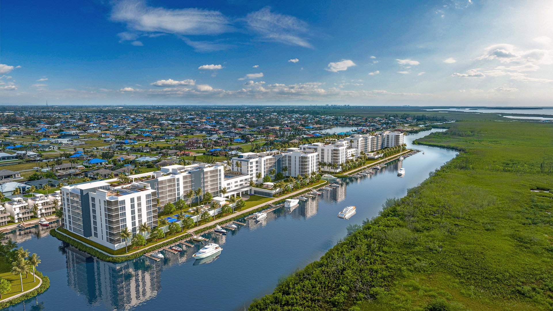 Aerial view toward existing northwest Cape Coral. This aerial concept follows the proposed canal-front buildings and marina toward nearby neighborhoods, with undeveloped preserve visible on the opposite side.