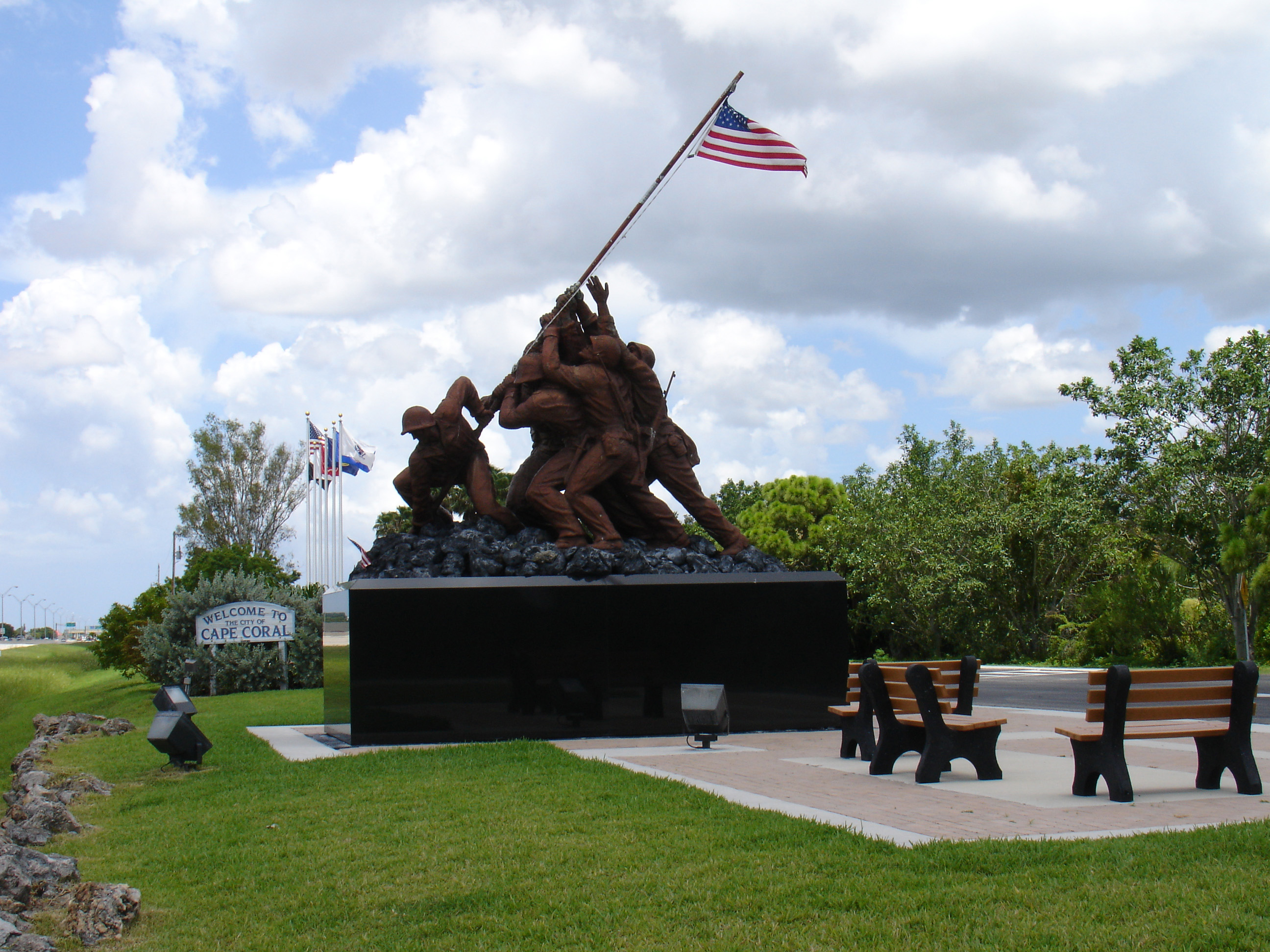 Iwo Jima memorial and American flag at the Four Mile Cove Veterans Memorial Area in Cape Coral